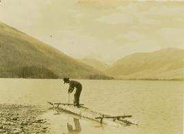 Unidentified crew man building a raft on Muinok Lake