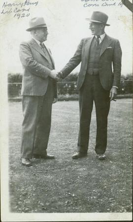Harry Perry, Liberal Candidate, and Sam Cocker (?), Conservative Candidate, shaking hands