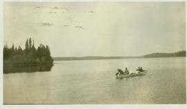Four men aboard a row boat 