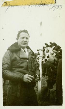 Jimmie Mattern standing next to the propeller of his plane, Prince George