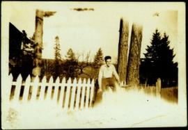 Hugh Taylor Jr. Sitting on White Picket Fence