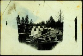 Lumber Pile and Cardboard Boxes