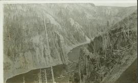 Landscape perspective of river running through a steep valley