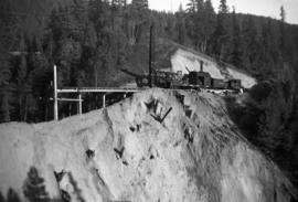 PGE pile driver 6040 replacing a washed out section of track with a new trestle